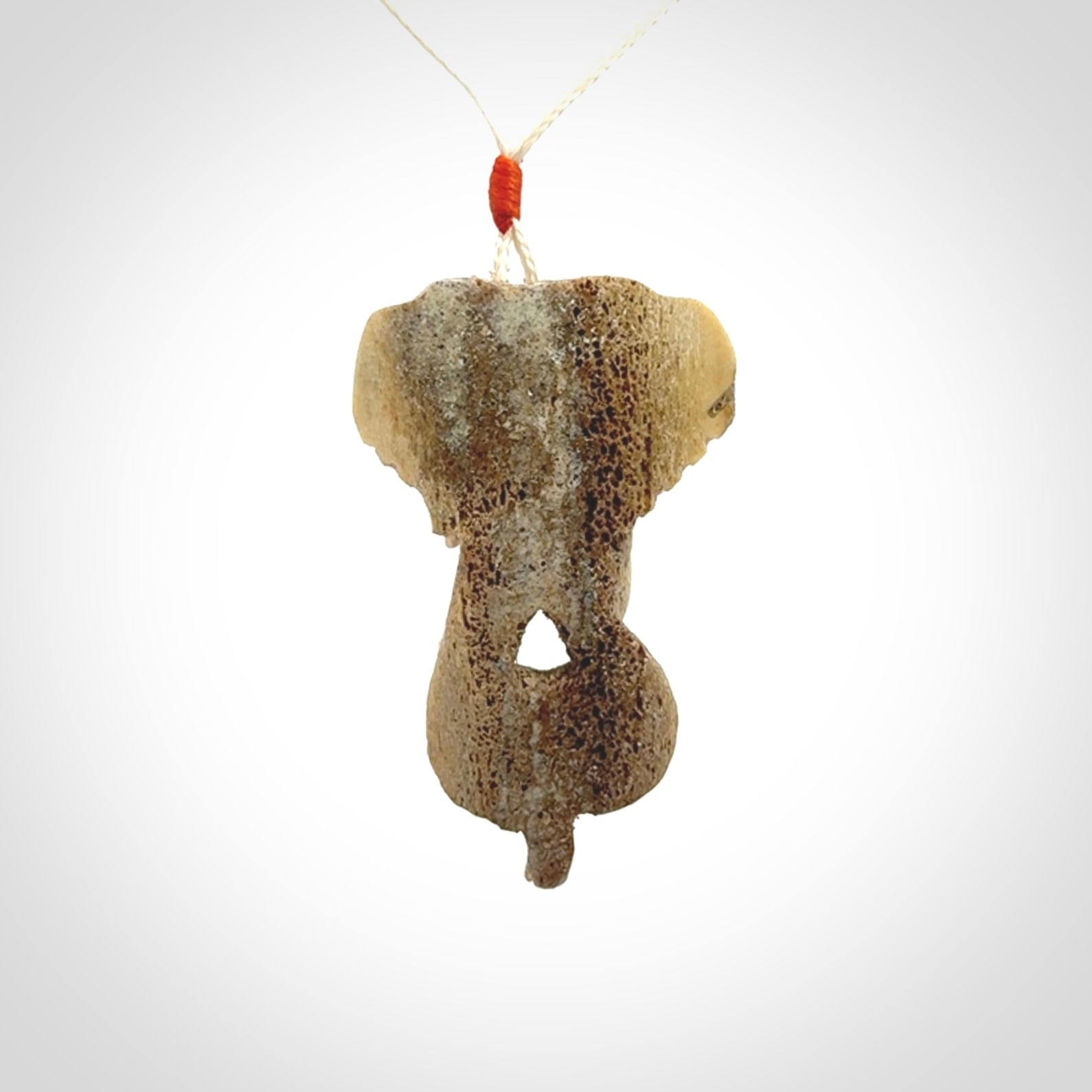 This is a triple elephant pendant, carved in a Deer Antler. The cord is length adjustable. Provided in a woven kete pouch and delivered with express courier.