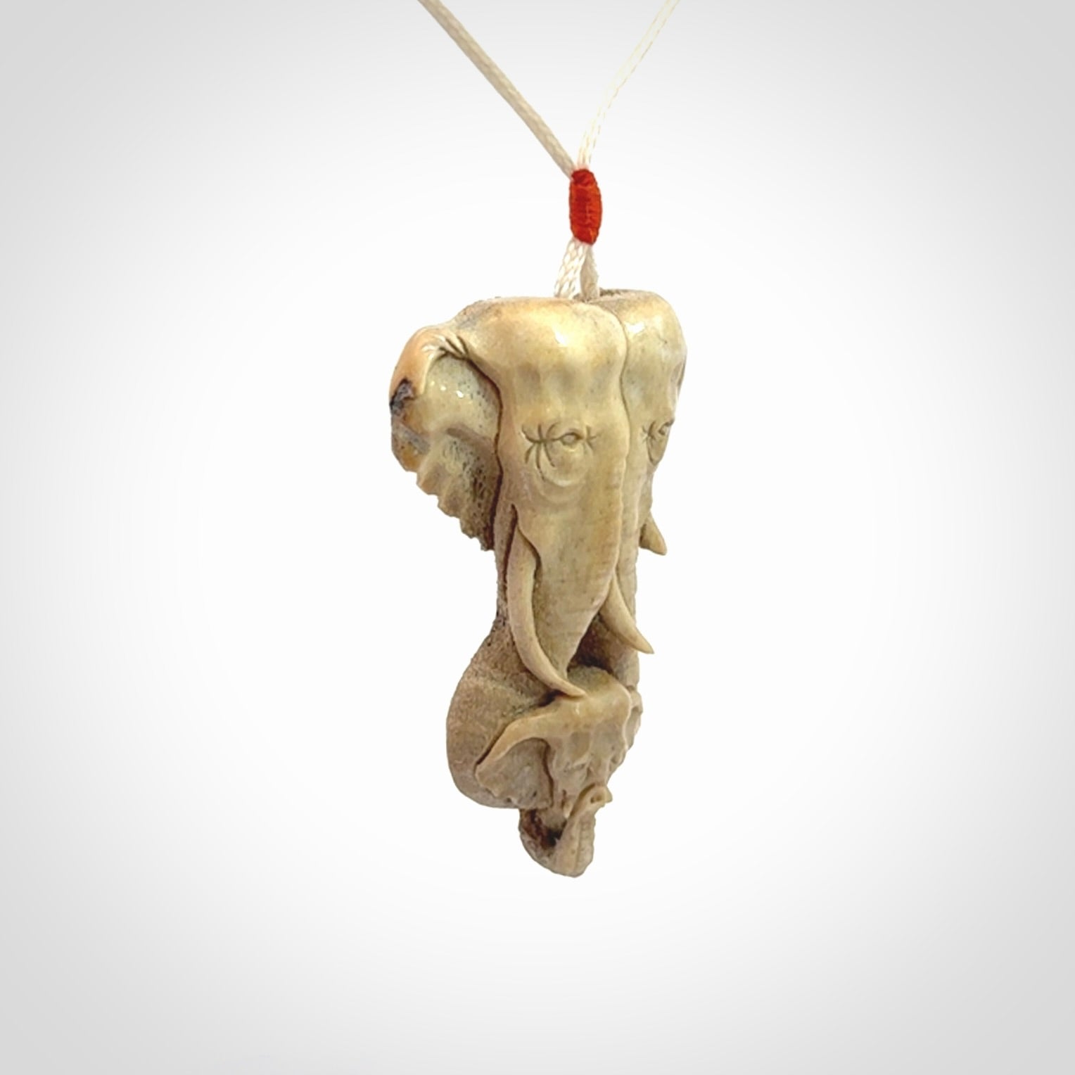 This is a triple elephant pendant, carved in a Deer Antler. The cord is length adjustable. Provided in a woven kete pouch and delivered with express courier.