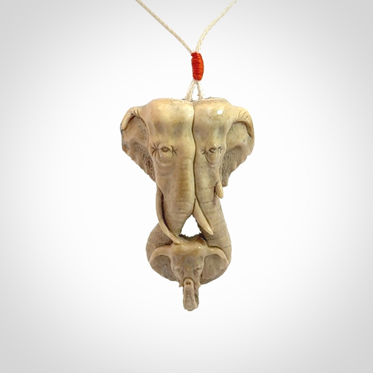 This is a triple elephant pendant, carved in a Deer Antler. The cord is length adjustable. Provided in a woven kete pouch and delivered with express courier.