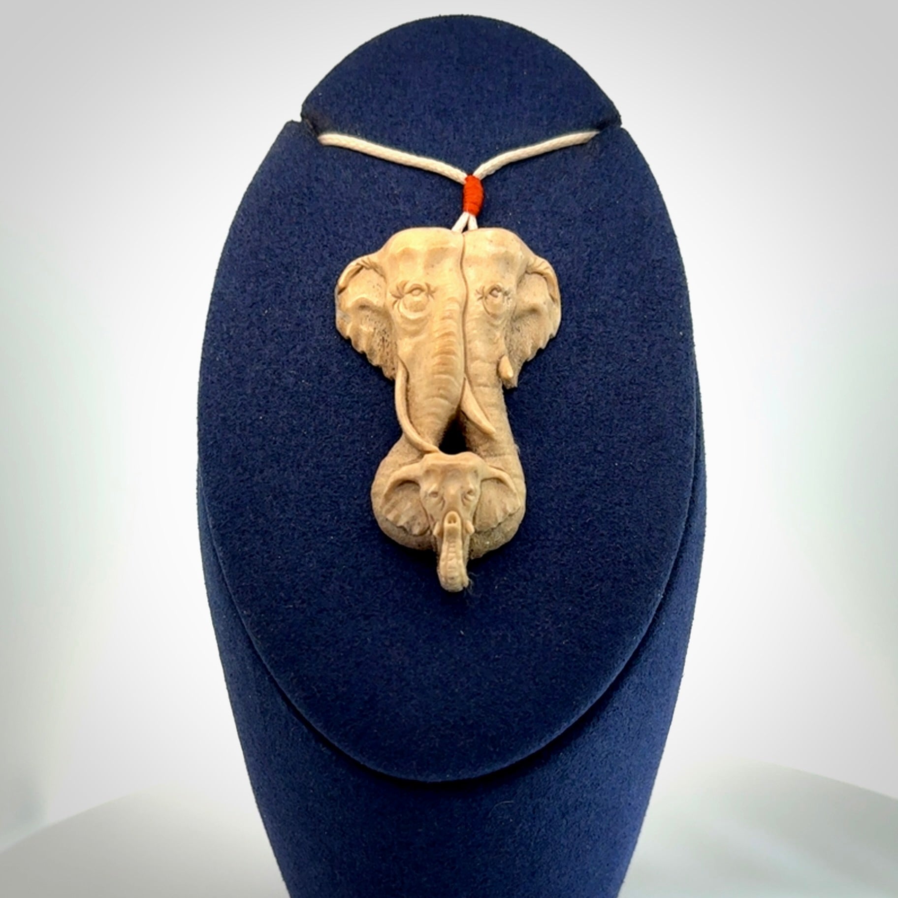 This is a triple elephant pendant, carved in a Deer Antler. The cord is length adjustable. Provided in a woven kete pouch and delivered with express courier.