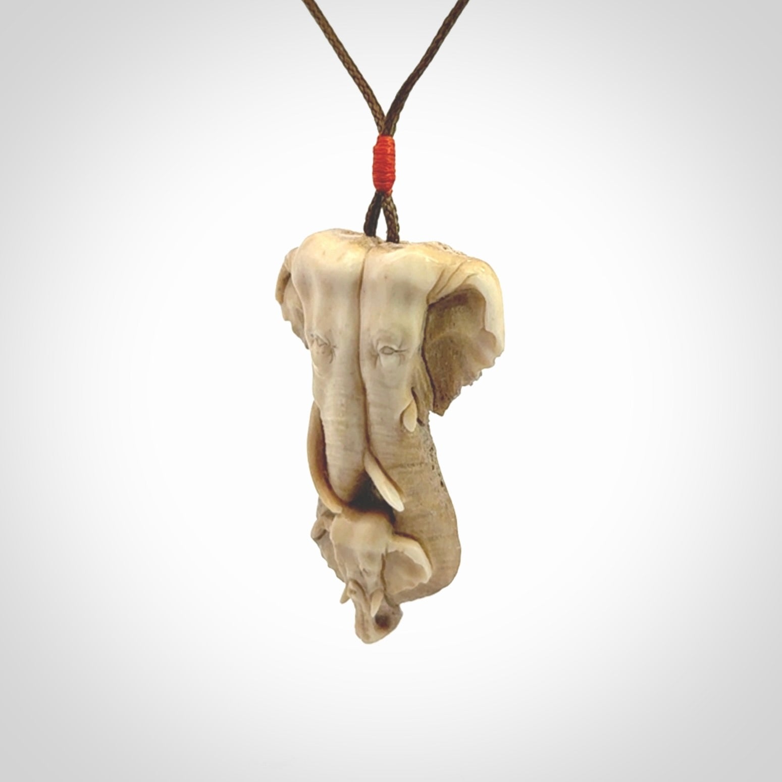 This is a triple elephant pendant, carved in a Deer Antler. The cord is length adjustable. Provided in a woven kete pouch and delivered with express courier.