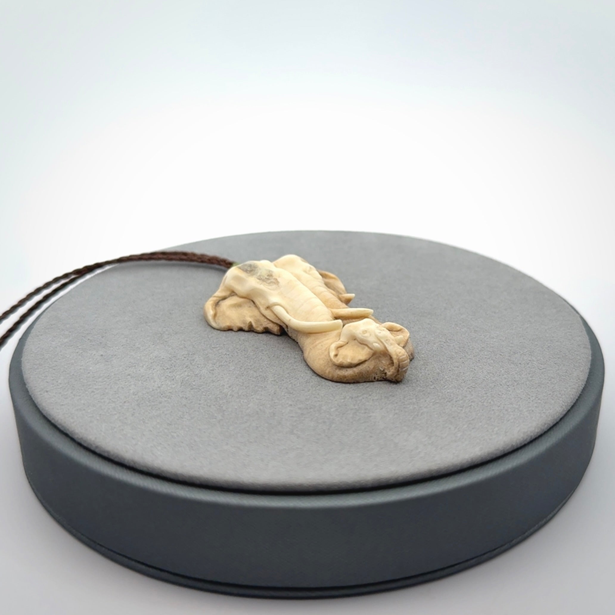 This is a triple elephant pendant, carved in a Deer Antler. The cord is length adjustable. Provided in a woven kete pouch and delivered with express courier.