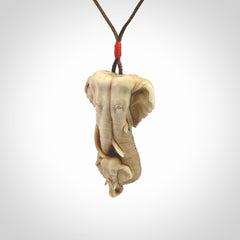This is a triple elephant pendant, carved in a Deer Antler. The cord is length adjustable. Provided in a woven kete pouch and delivered with express courier.