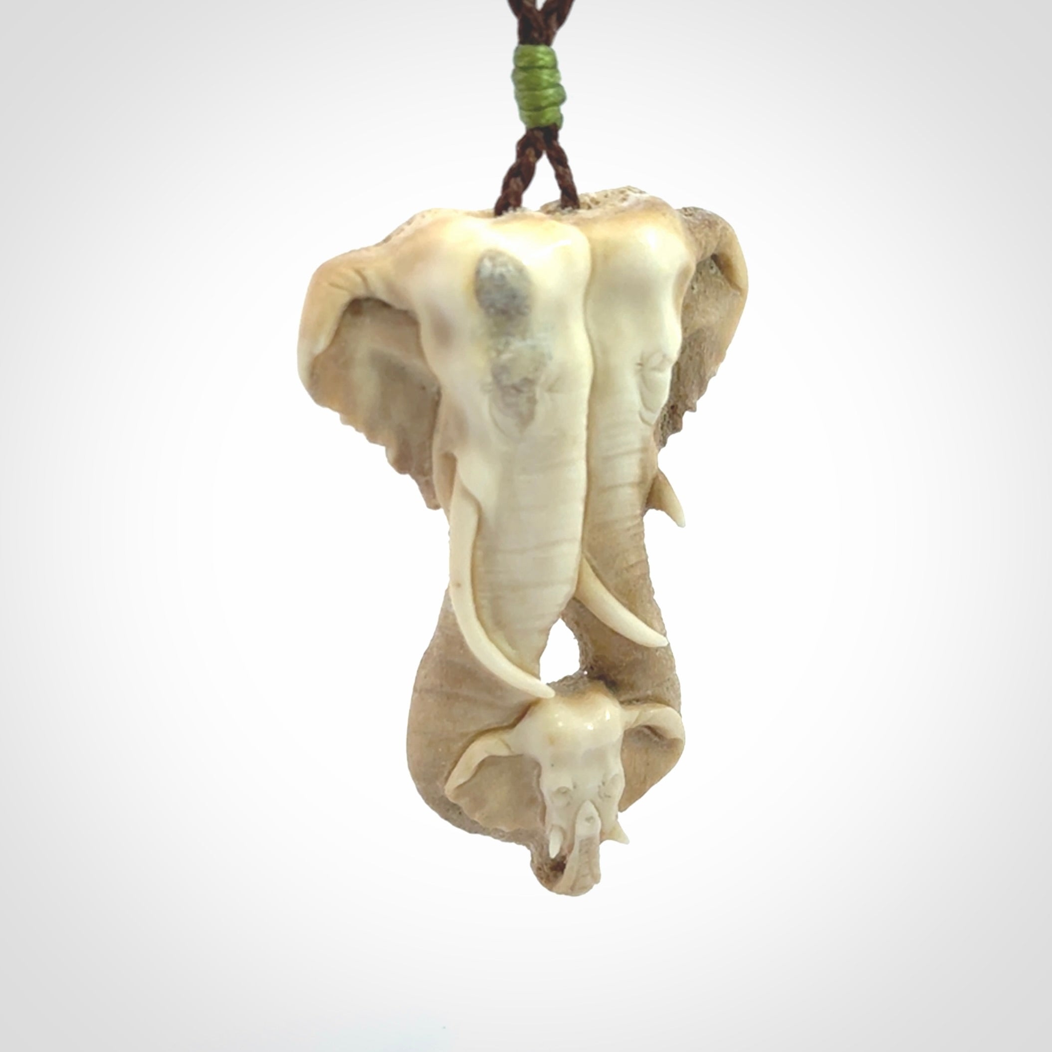 This is a triple elephant pendant, carved in a Deer Antler. The cord is length adjustable. Provided in a woven kete pouch and delivered with express courier.
