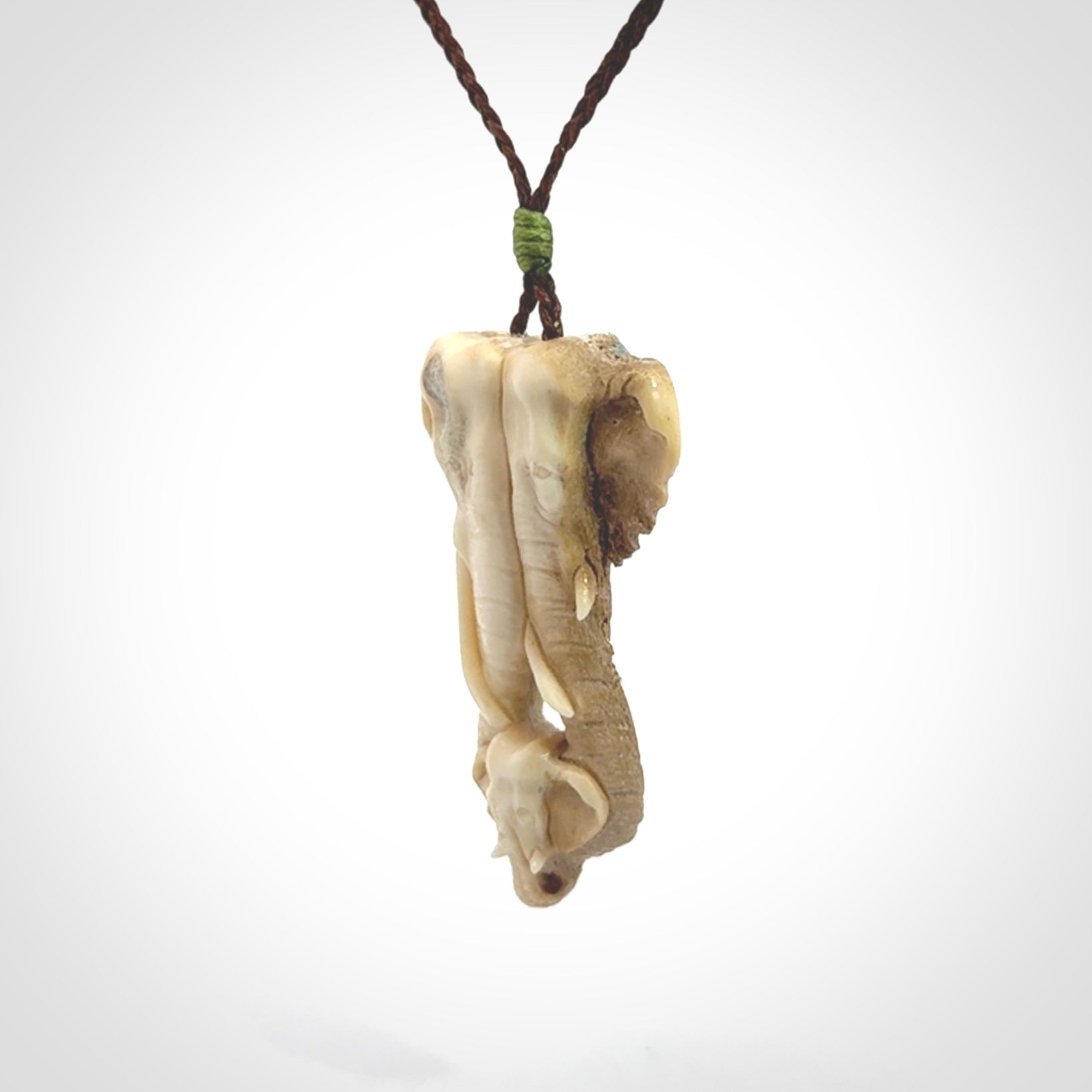 This is a triple elephant pendant, carved in a Deer Antler. The cord is length adjustable. Provided in a woven kete pouch and delivered with express courier.