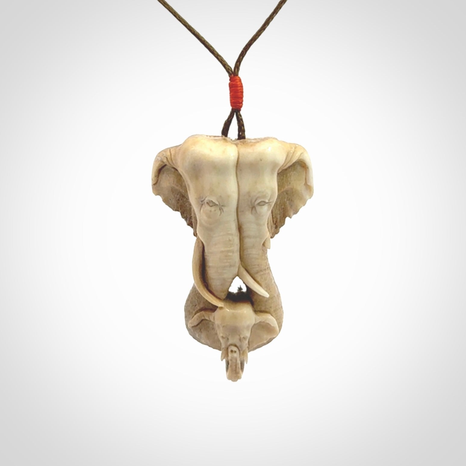 This is a triple elephant pendant, carved in a Deer Antler. The cord is length adjustable. Provided in a woven kete pouch and delivered with express courier.