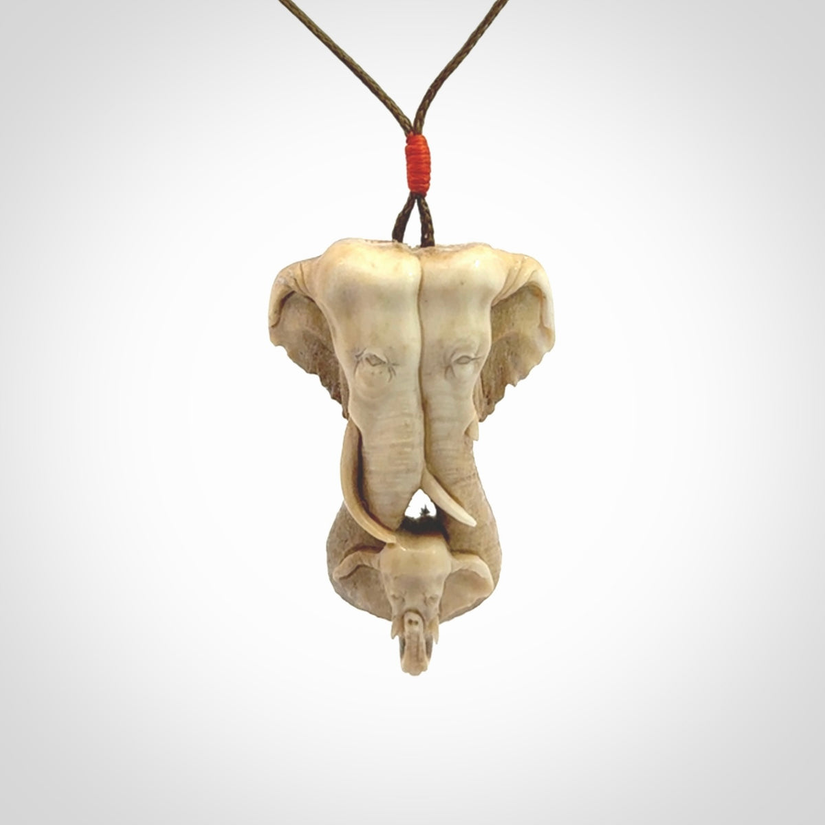 This is a triple elephant pendant, carved in a Deer Antler. The cord is length adjustable. Provided in a woven kete pouch and delivered with express courier.