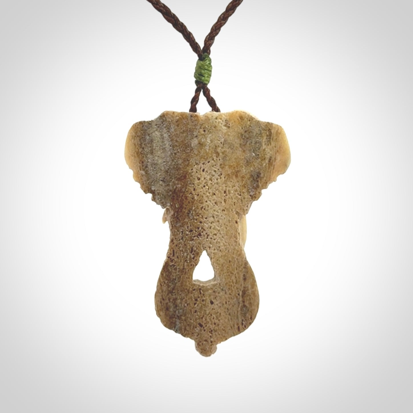 This is a triple elephant pendant, carved in a Deer Antler. The cord is length adjustable. Provided in a woven kete pouch and delivered with express courier.
