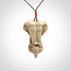 This is a triple elephant pendant, carved in a Deer Antler. The cord is length adjustable. Provided in a woven kete pouch and delivered with express courier.