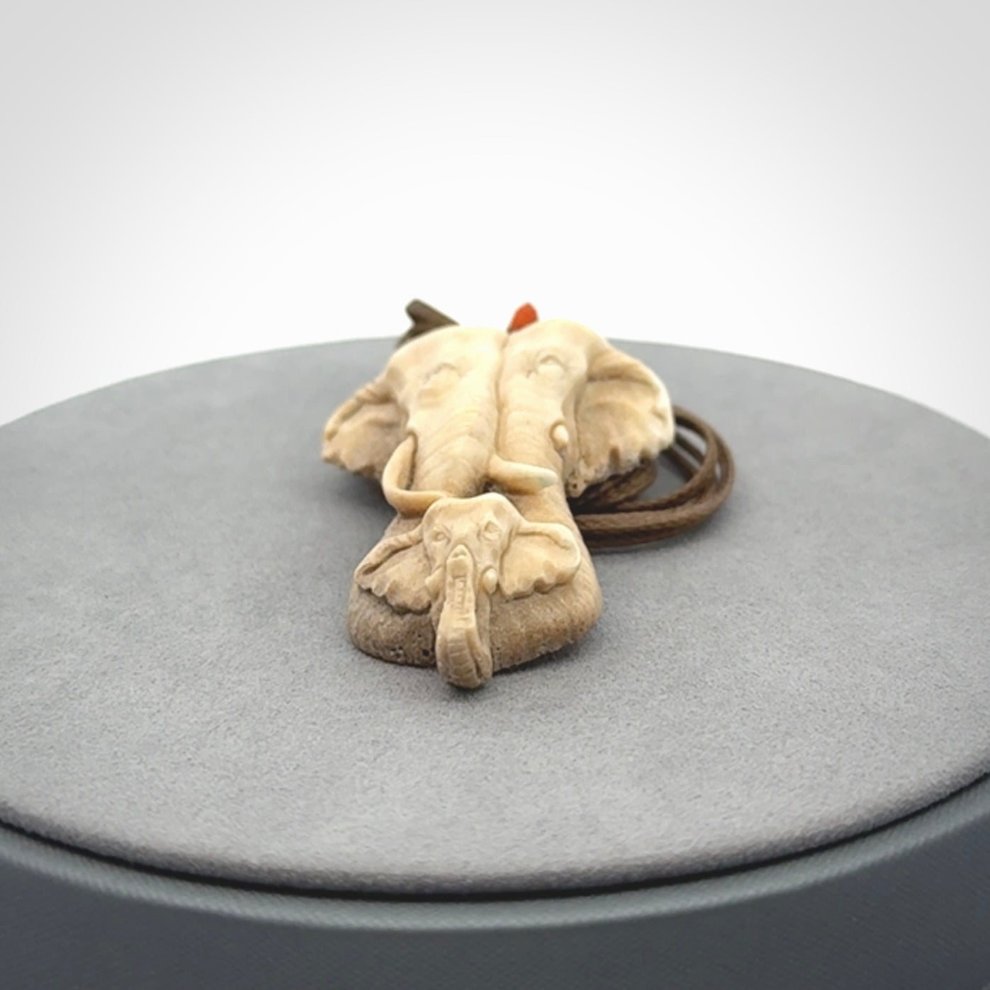 This is a triple elephant pendant, carved in a Deer Antler. The cord is length adjustable. Provided in a woven kete pouch and delivered with express courier.