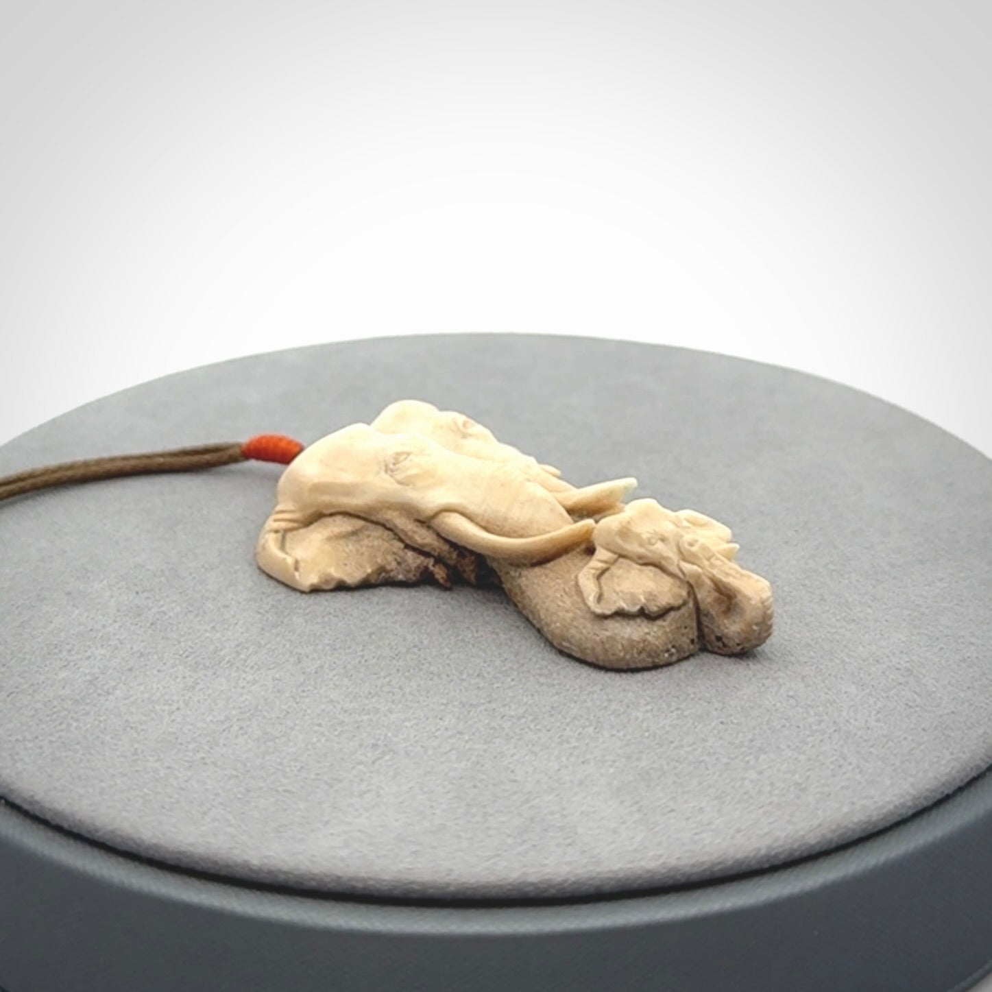 This is a triple elephant pendant, carved in a Deer Antler. The cord is length adjustable. Provided in a woven kete pouch and delivered with express courier.