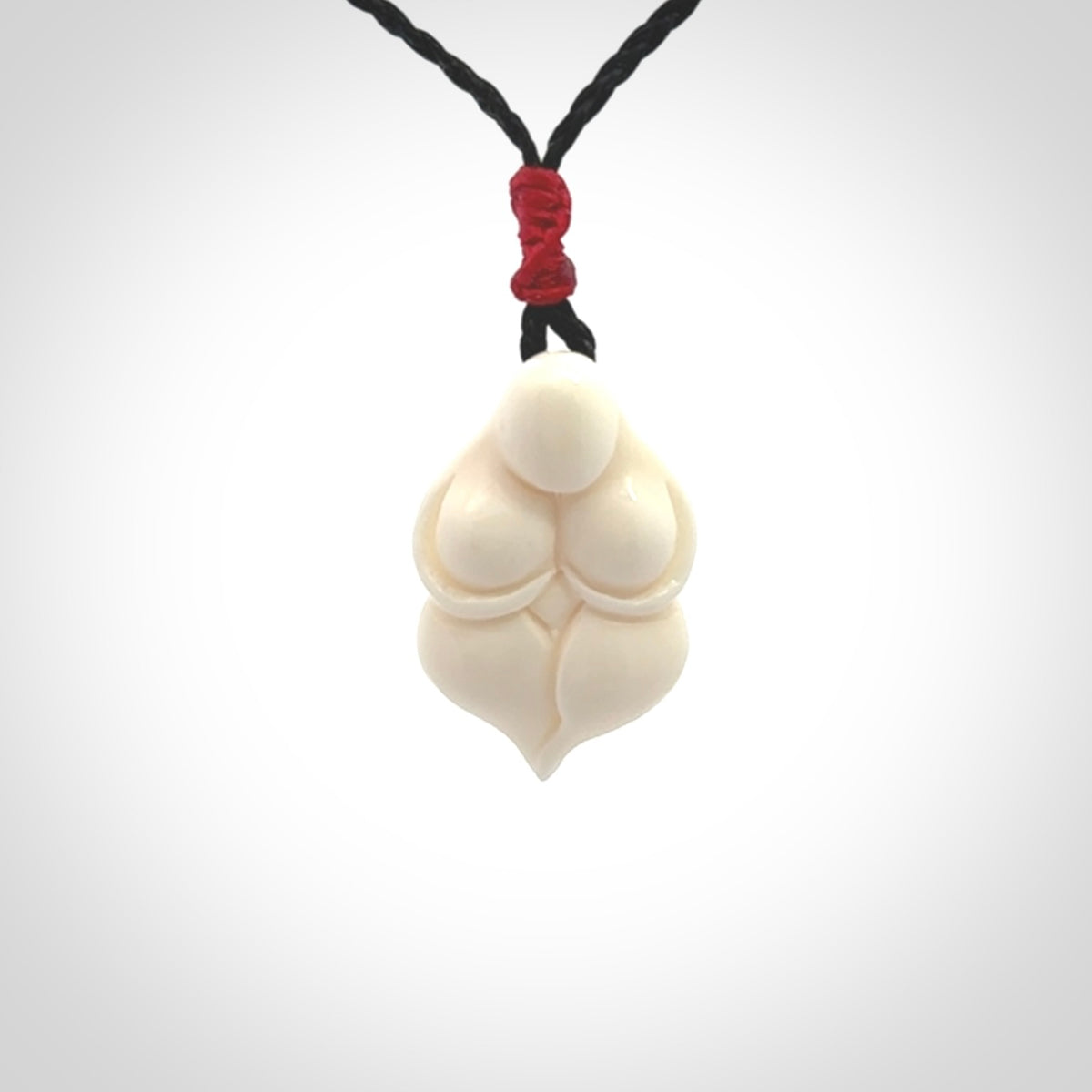 Hand carved goddess pendant. Venus of Willendorf pendant carved in bone. Made by NZ Pacific. Bone jewellery for sale online.