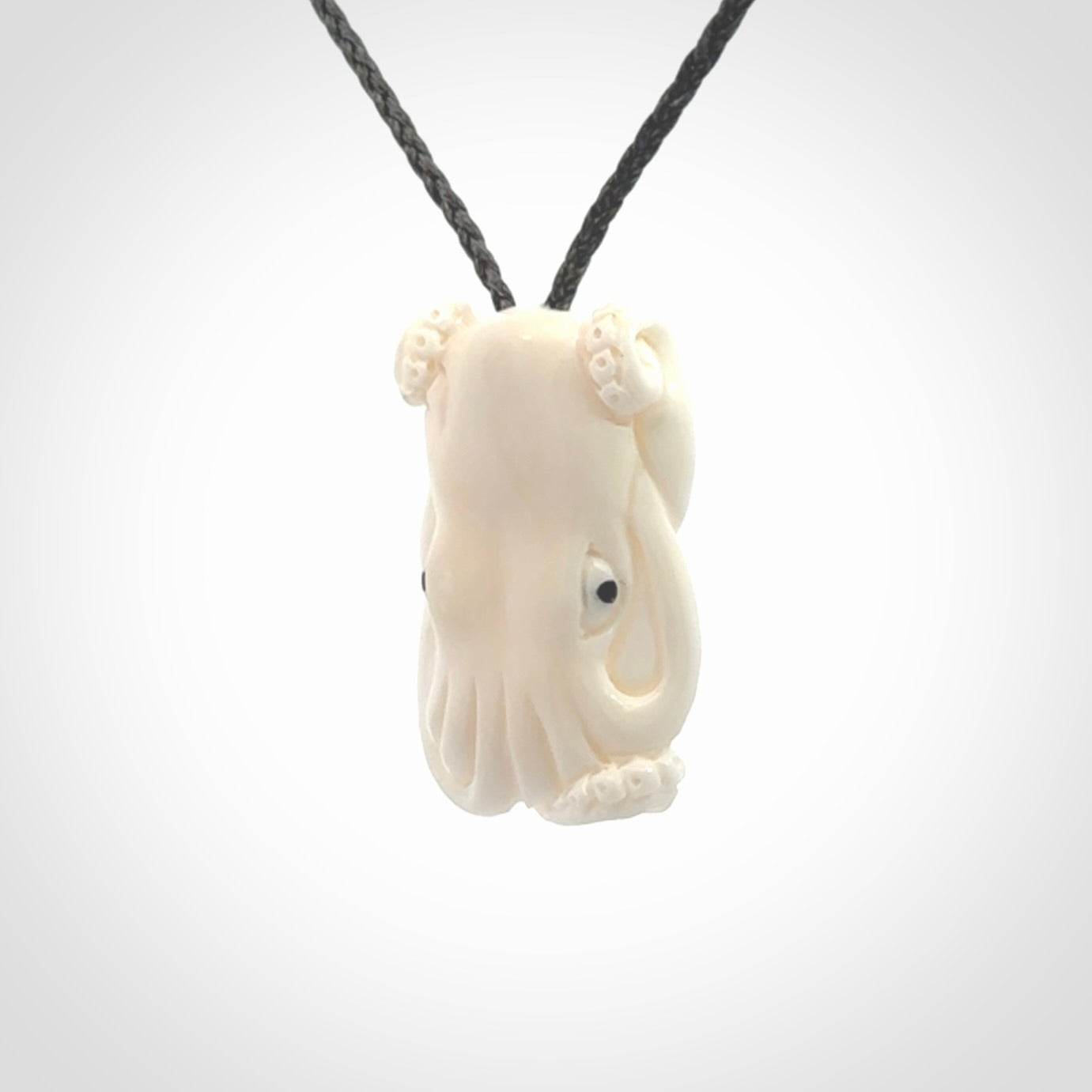 This is a beautiful little hand carved octopus pendant. It is a very cute little pendant that we have carved in natural, untreated bone. We provide these with adjustable cords and shipping is included worldwide.