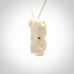 This is a beautiful little hand carved octopus pendant. It is a very cute little pendant that we have carved in natural, untreated bone. We provide these with meringue adjustable cords and shipping is included worldwide.