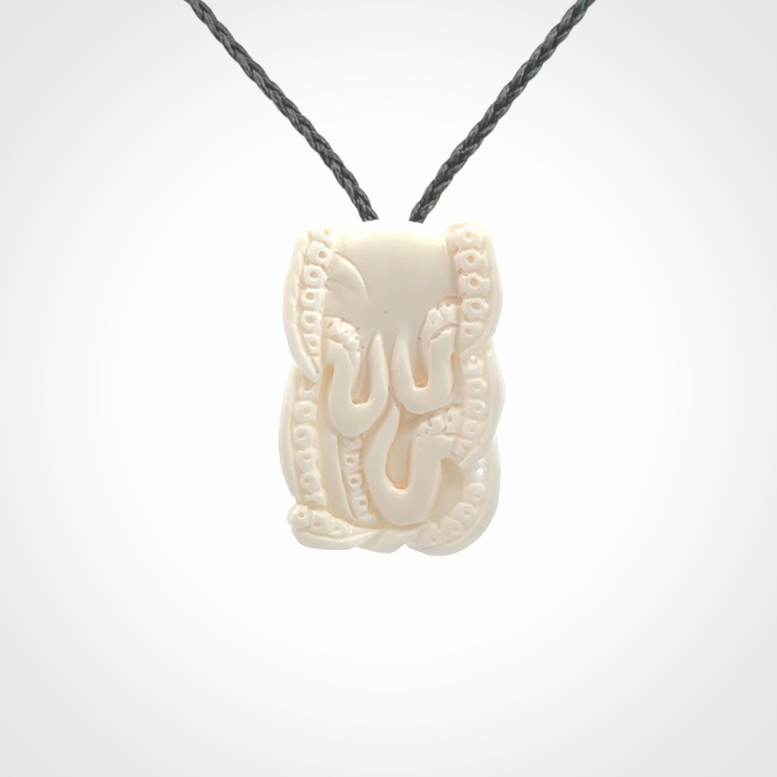 This is a beautiful little hand carved octopus pendant. It is a very cute little pendant that we have carved in natural, untreated bone. We provide these with adjustable cords and shipping is included worldwide.