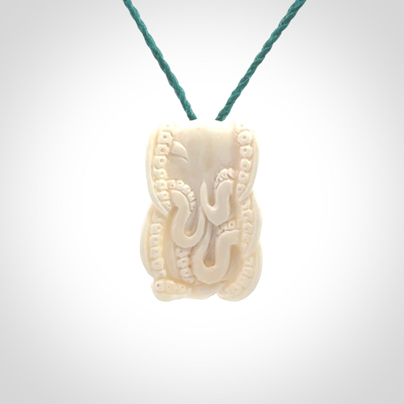 This is a beautiful little hand carved octopus pendant. It is a very cute little pendant that we have carved in natural, untreated bone. We provide these with adjustable cords and shipping is included worldwide.