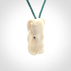 This is a beautiful little hand carved octopus pendant. It is a very cute little pendant that we have carved in natural, untreated bone. We provide these with adjustable cords and shipping is included worldwide.