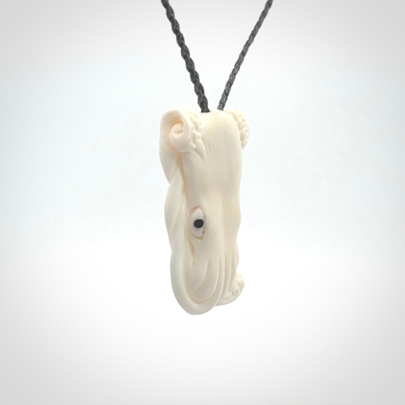 This is a beautiful little hand carved octopus pendant. It is a very cute little pendant that we have carved in natural, untreated bone. We provide these with adjustable cords and shipping is included worldwide.