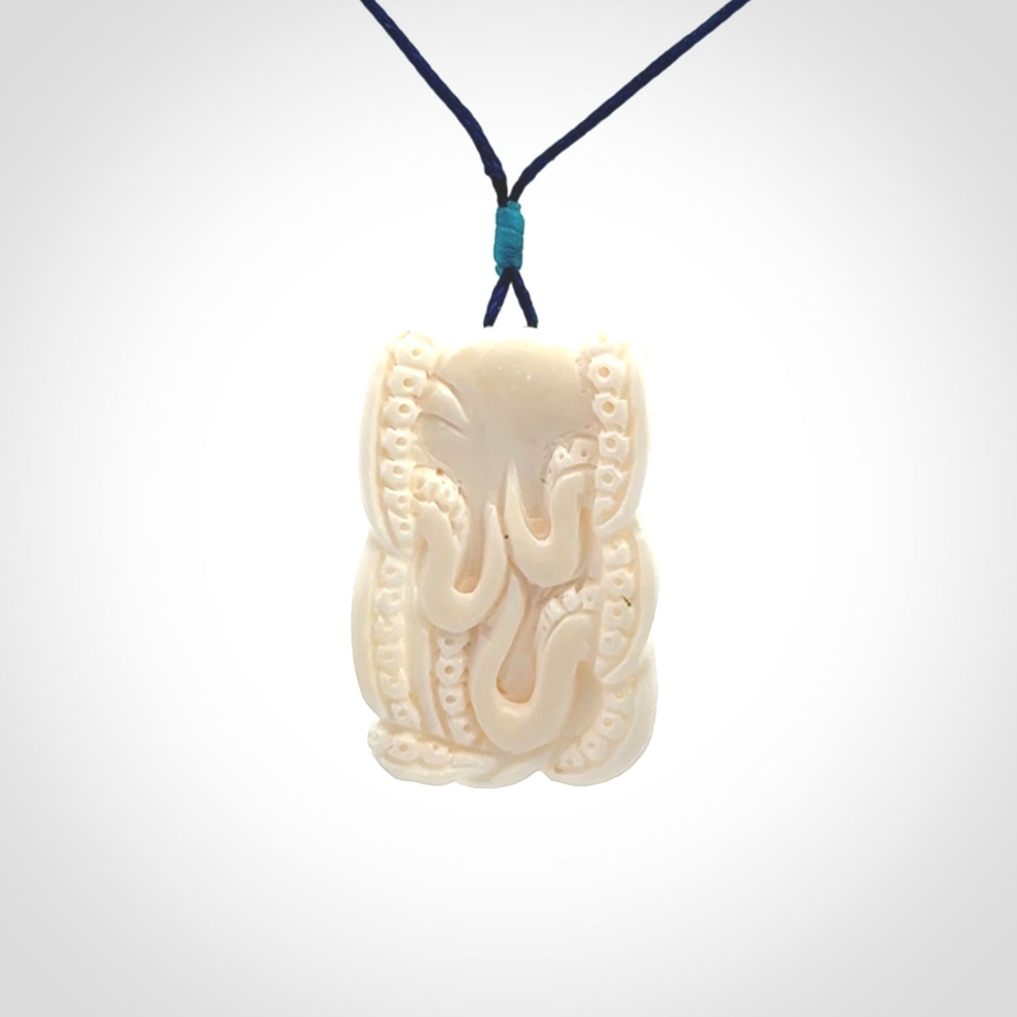 This is a beautiful little hand carved octopus pendant. It is a very cute little pendant that we have carved in natural, untreated bone. We provide these with adjustable cords and shipping is included worldwide.
