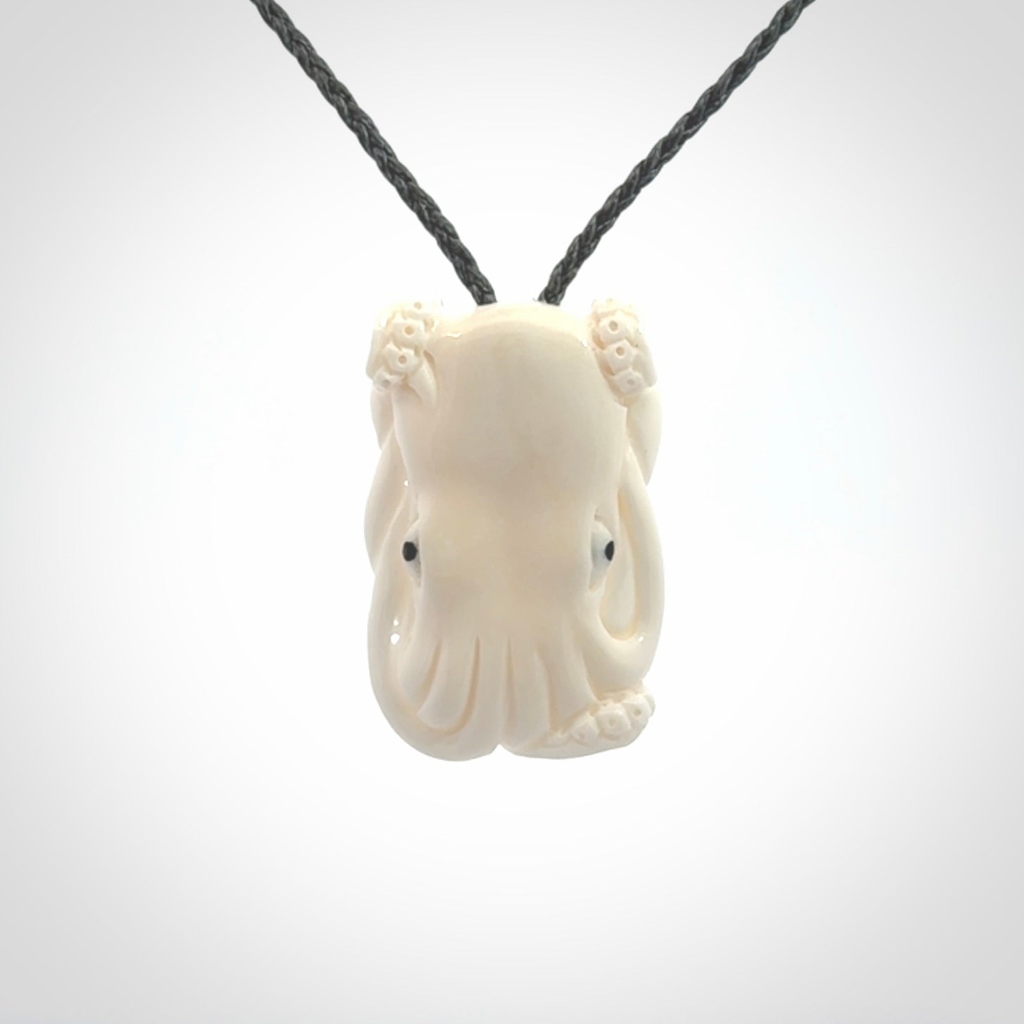 This is a beautiful little hand carved octopus pendant. It is a very cute little pendant that we have carved in natural, untreated bone. We provide these with adjustable cords and shipping is included worldwide.