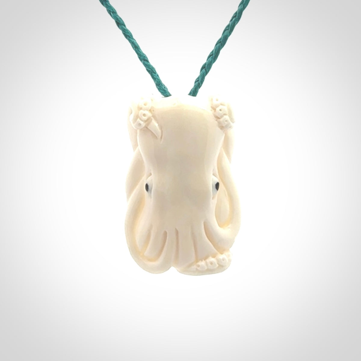This is a beautiful little hand carved octopus pendant. It is a very cute little pendant that we have carved in natural, untreated bone. We provide these with adjustable cords and shipping is included worldwide.