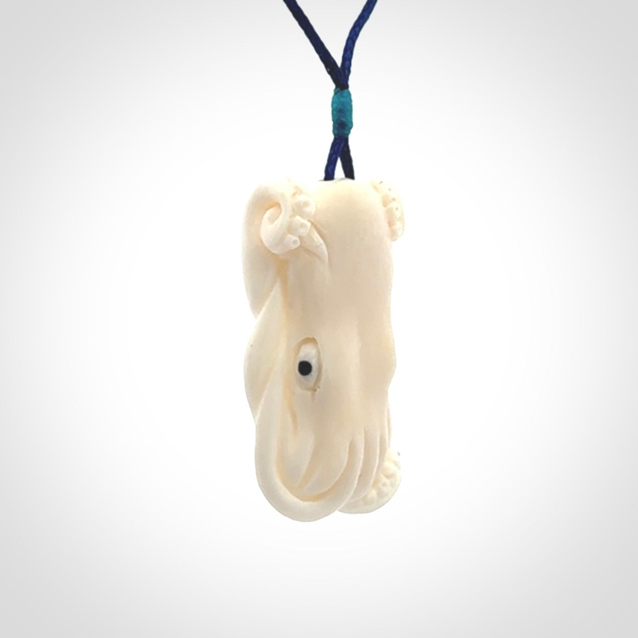 This is a beautiful little hand carved octopus pendant. It is a very cute little pendant that we have carved in natural, untreated bone. We provide these with adjustable cords and shipping is included worldwide.