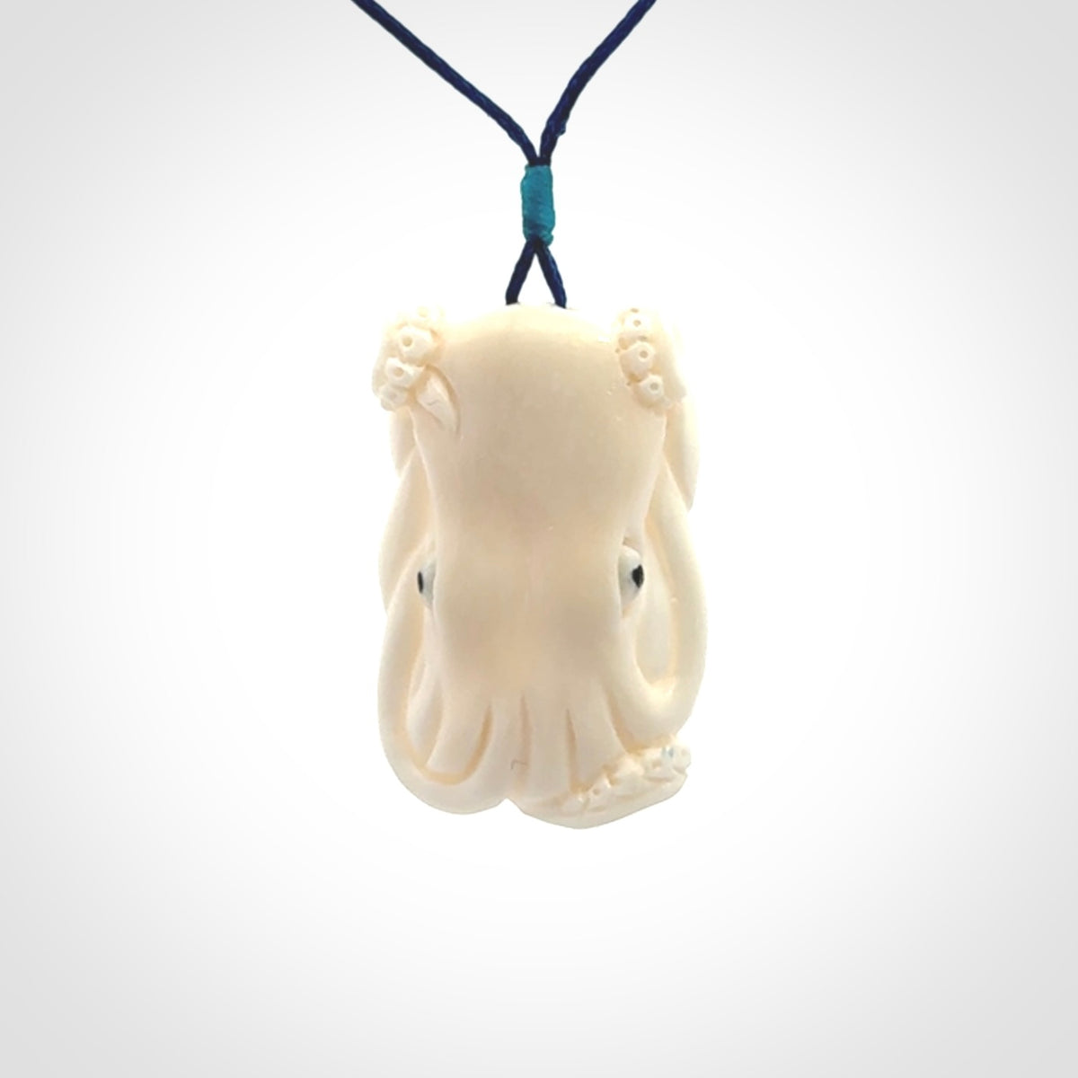 This is a beautiful little hand carved octopus pendant. It is a very cute little pendant that we have carved in natural, untreated bone. We provide these with adjustable cords and shipping is included worldwide.