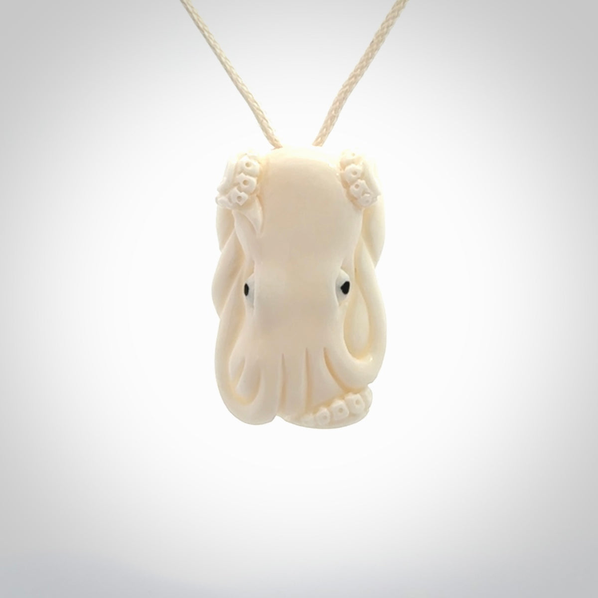 This is a beautiful little hand carved octopus pendant. It is a very cute little pendant that we have carved in natural, untreated bone. We provide these with meringue adjustable cords and shipping is included worldwide.