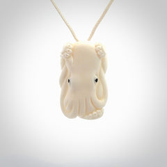 This is a beautiful little hand carved octopus pendant. It is a very cute little pendant that we have carved in natural, untreated bone. We provide these with meringue adjustable cords and shipping is included worldwide.