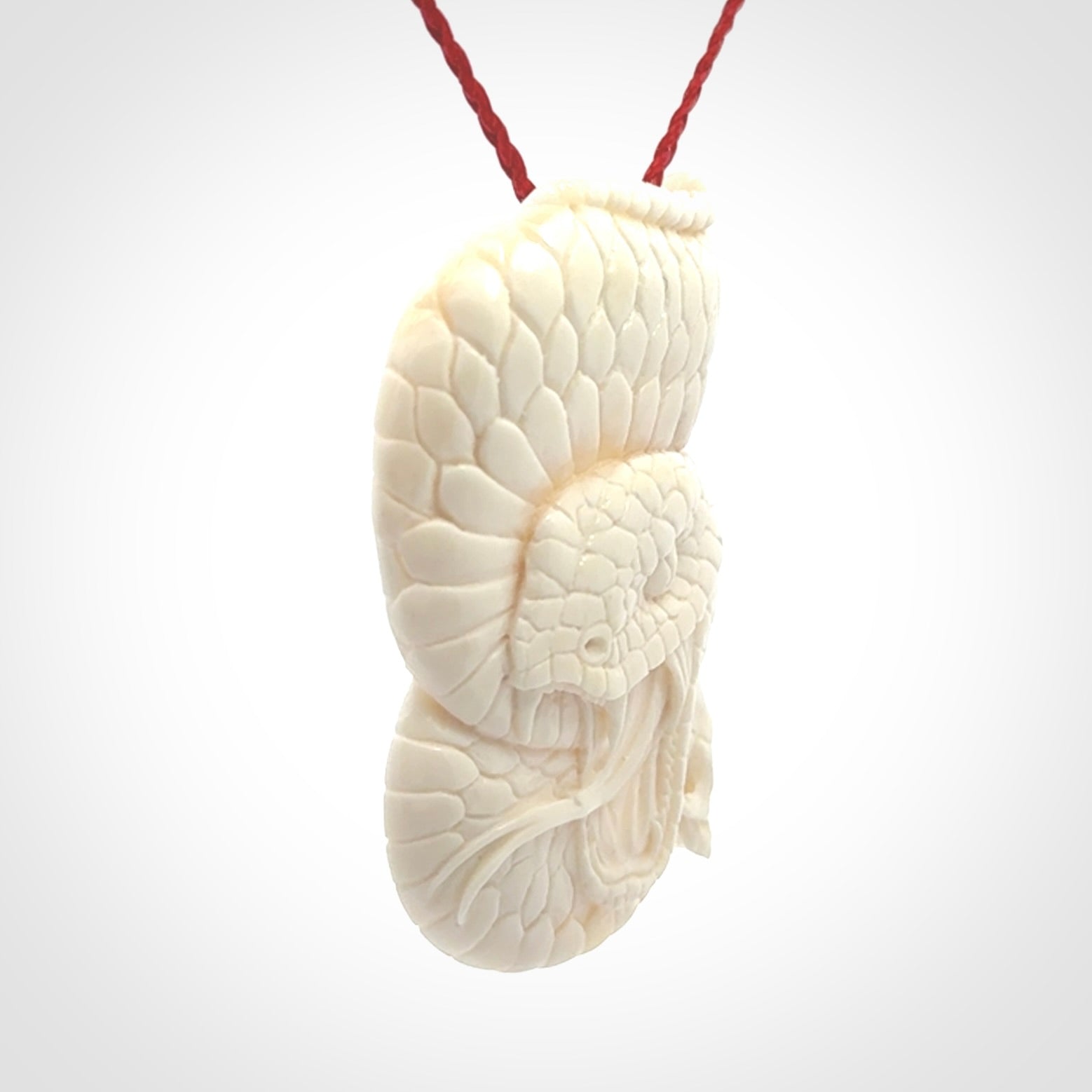 Hand carved bone snake skull pendant. Hand carved by NZ Pacific. Free postage worldwide. Hand made snake with skull necklace from bone. Snake skull necklace for men and women.