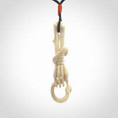 Hand carved deer antler skeleton hand with snake pendant. Hand carved by NZ Pacific. Free postage worldwide. Hand made skeleton hand with snake necklace from deer antler. Skeleton hand with snake necklace for men and women.