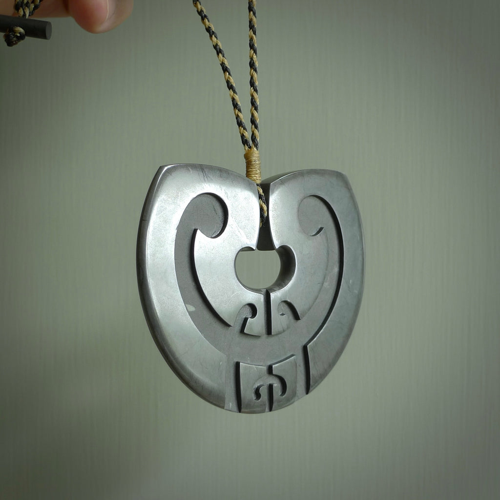 HAND CARVED NEW ZEALAND ARGILLITE KORU PENDANT. ARGILLITE STONE