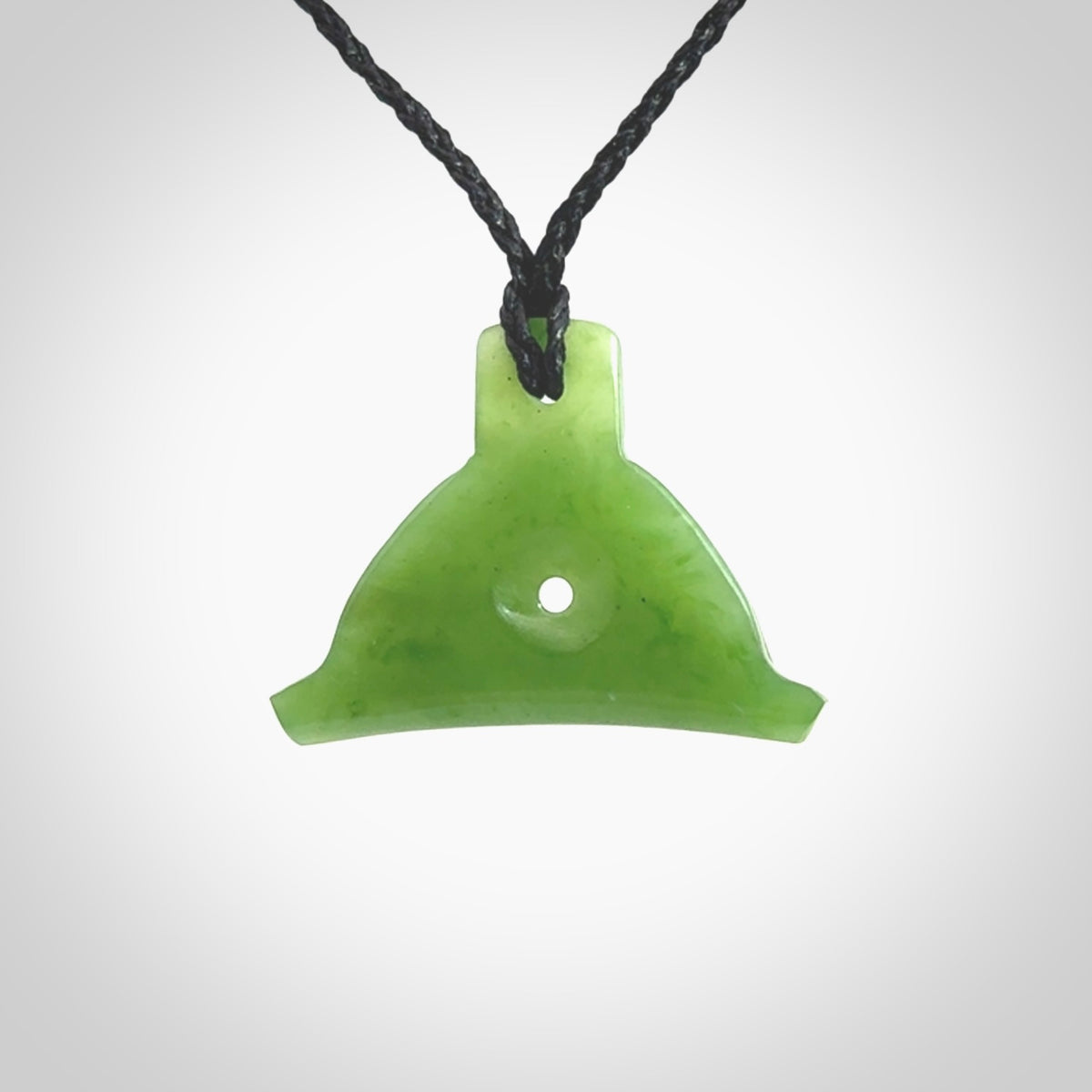 Hand carved New Zealand jade dog whistle. Carved for NZ Pacific by master carver Ross Crump. Jade dog whistle pendant provided with adjustable cord and delivered with express courier.