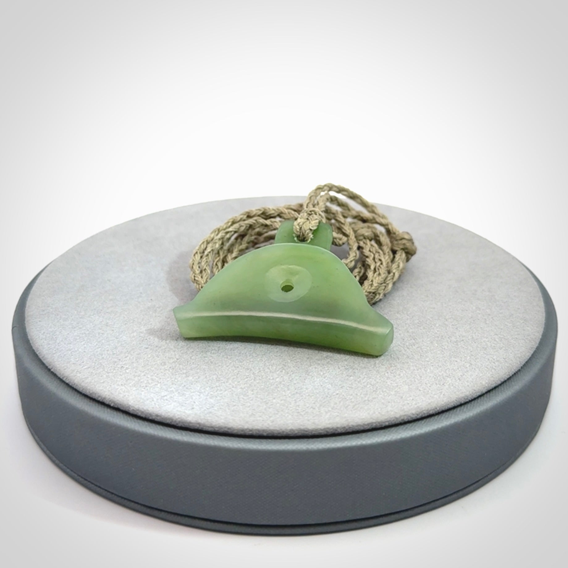 Hand carved New Zealand jade dog whistle. Carved for NZ Pacific by master carver Ross Crump. Jade dog whistle pendant provided with adjustable cord and delivered with express courier.