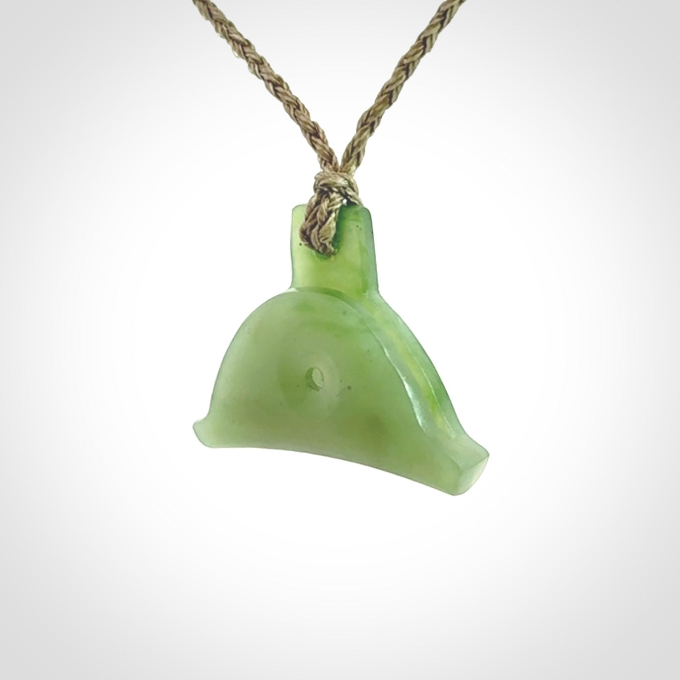Hand carved New Zealand jade dog whistle. Carved for NZ Pacific by master carver Ross Crump. Jade dog whistle pendant provided with adjustable cord and delivered with express courier.