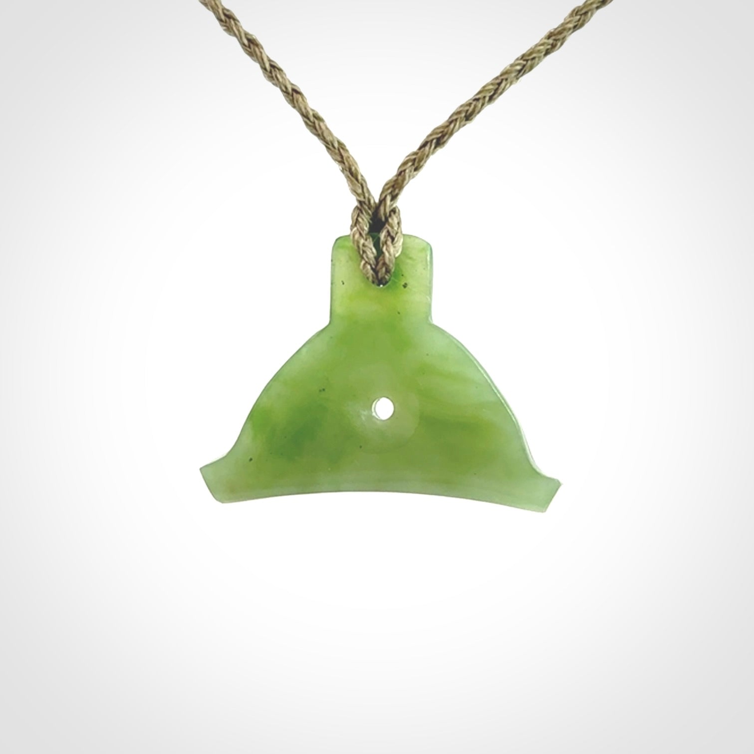 Hand carved New Zealand jade dog whistle. Carved for NZ Pacific by master carver Ross Crump. Jade dog whistle pendant provided with adjustable cord and delivered with express courier.
