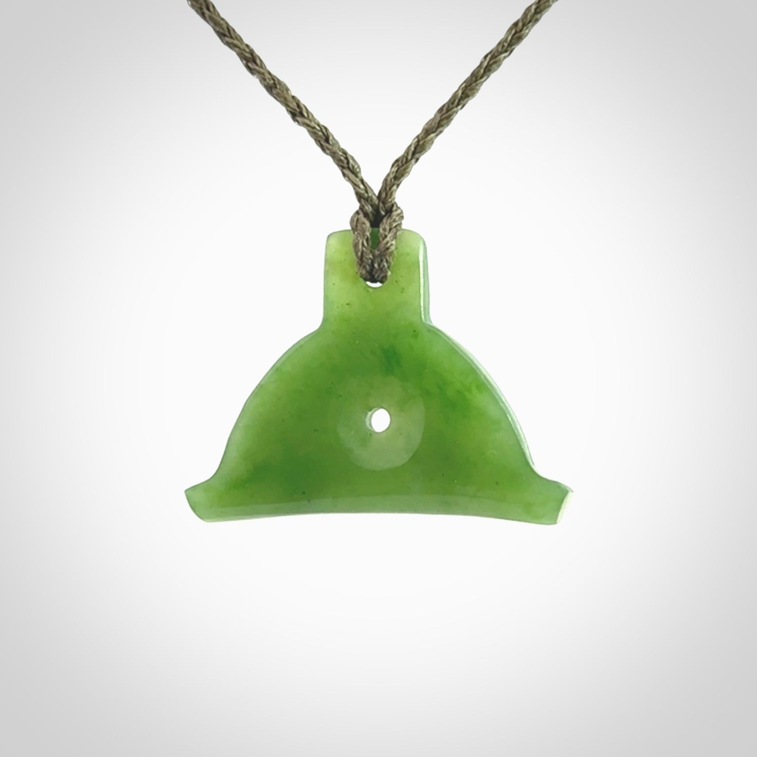 Hand carved New Zealand jade dog whistle. Carved for NZ Pacific by master carver Ross Crump. Jade dog whistle pendant provided with adjustable cord and delivered with express courier.