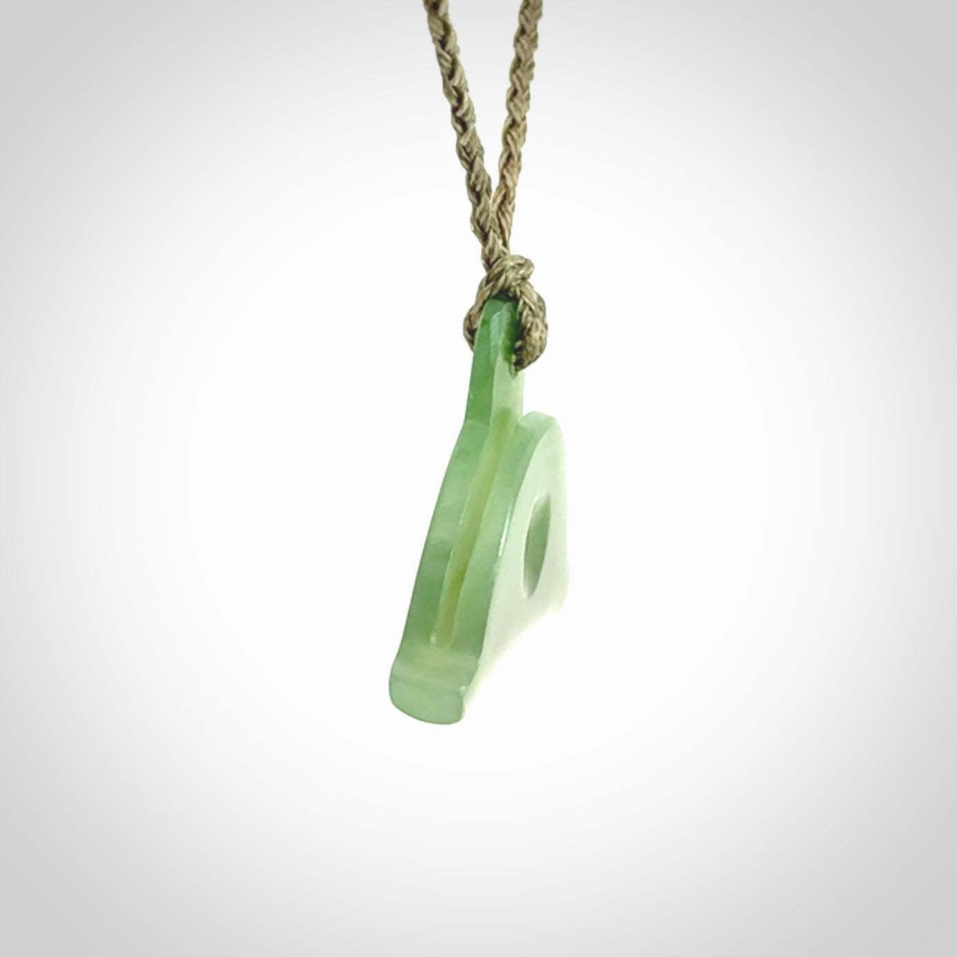 Hand carved New Zealand jade dog whistle. Carved for NZ Pacific by master carver Ross Crump. Jade dog whistle pendant provided with adjustable cord and delivered with express courier.