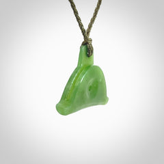 Hand carved New Zealand jade dog whistle. Carved for NZ Pacific by master carver Ross Crump. Jade dog whistle pendant provided with adjustable cord and delivered with express courier.