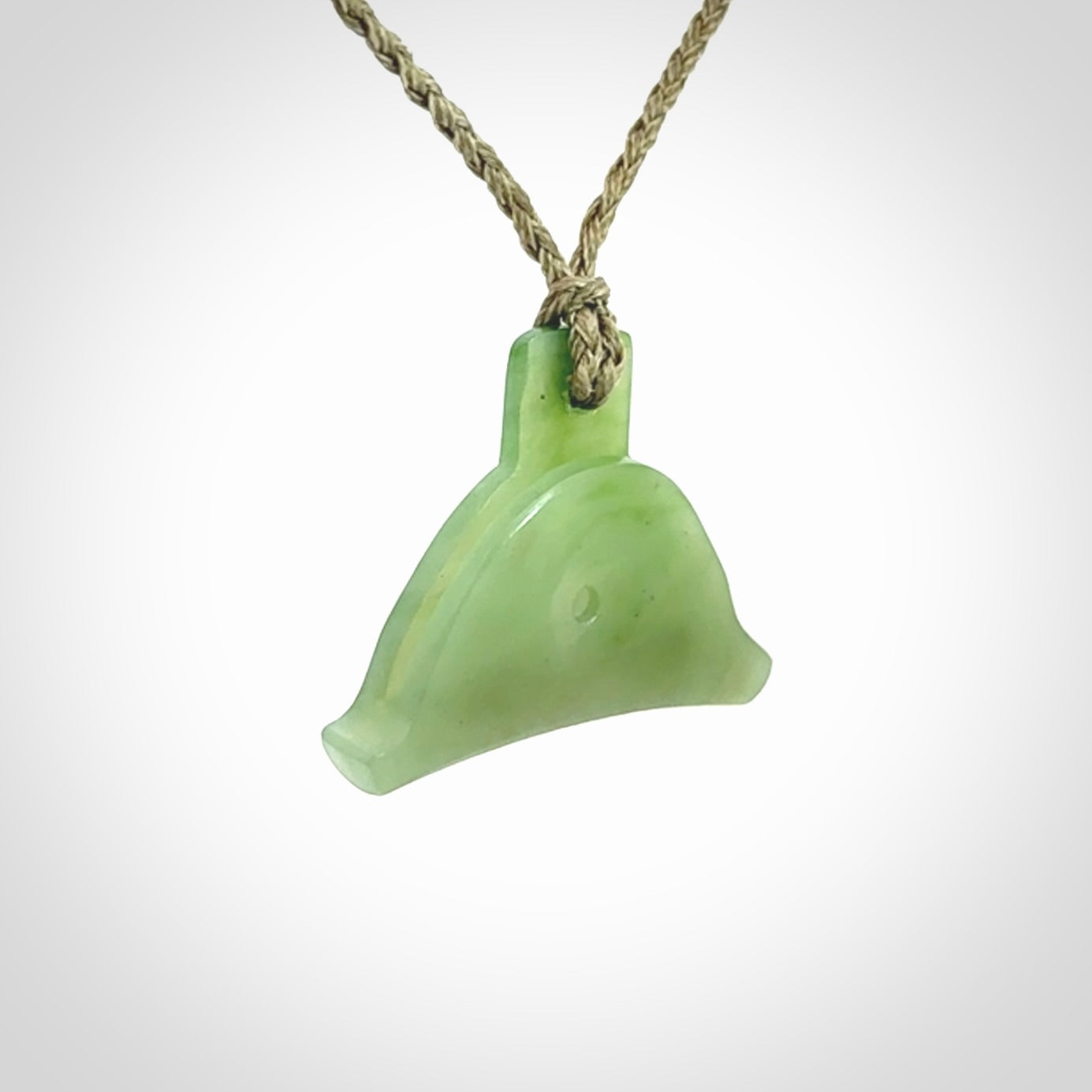 Hand carved New Zealand jade dog whistle. Carved for NZ Pacific by master carver Ross Crump. Jade dog whistle pendant provided with adjustable cord and delivered with express courier.
