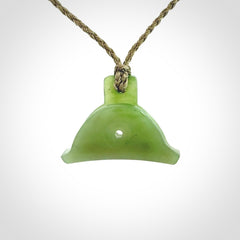 Hand carved New Zealand jade dog whistle. Carved for NZ Pacific by master carver Ross Crump. Jade dog whistle pendant provided with adjustable cord and delivered with express courier.