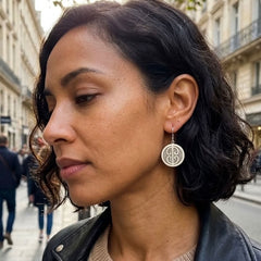 Woman wearing bone earrings