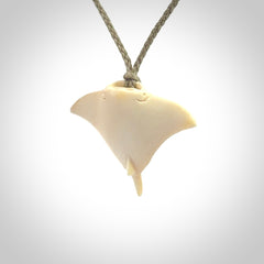Woolly mammoth tusk manta ray pendant. Hand carved Mammoth Tusk manta ray pendant. Provided with adjustable cord.