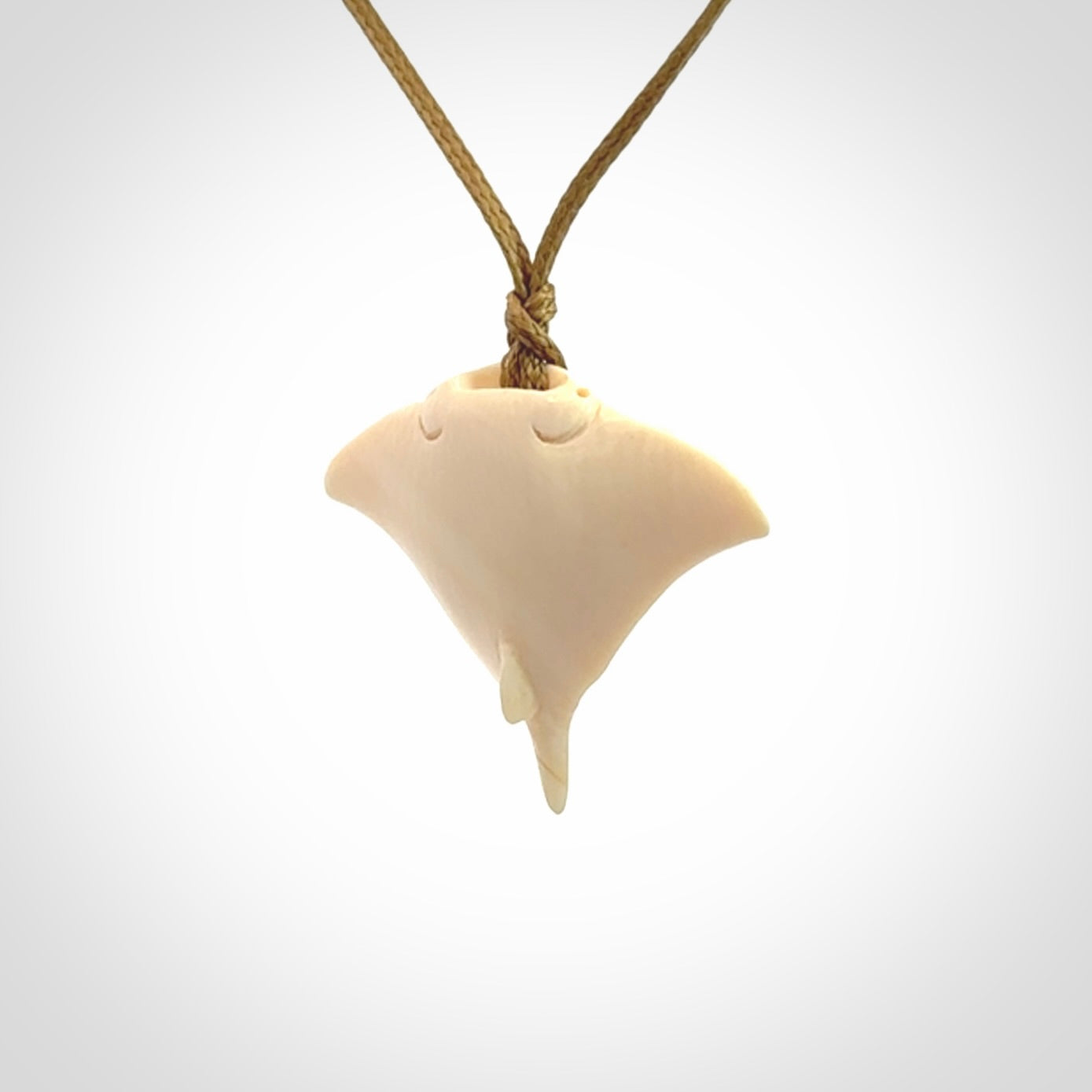 Woolly mammoth tusk manta ray pendant. Hand carved Mammoth Tusk manta ray pendant. Provided with adjustable cord.