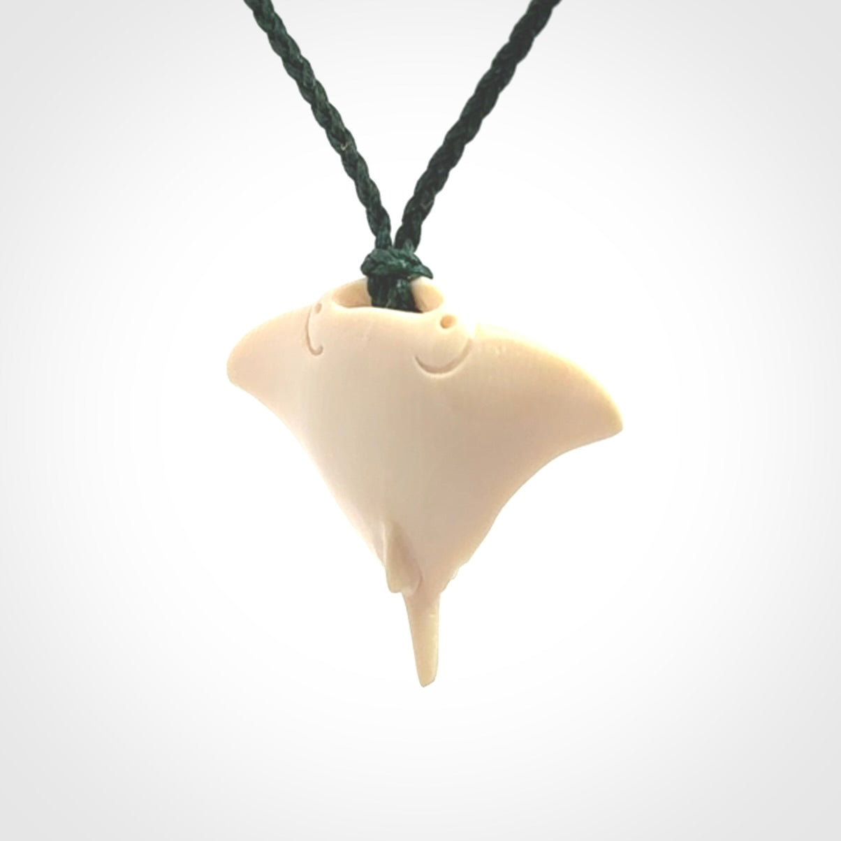 Woolly mammoth tusk manta ray pendant. Hand carved Mammoth Tusk manta ray pendant. Provided with adjustable cord.