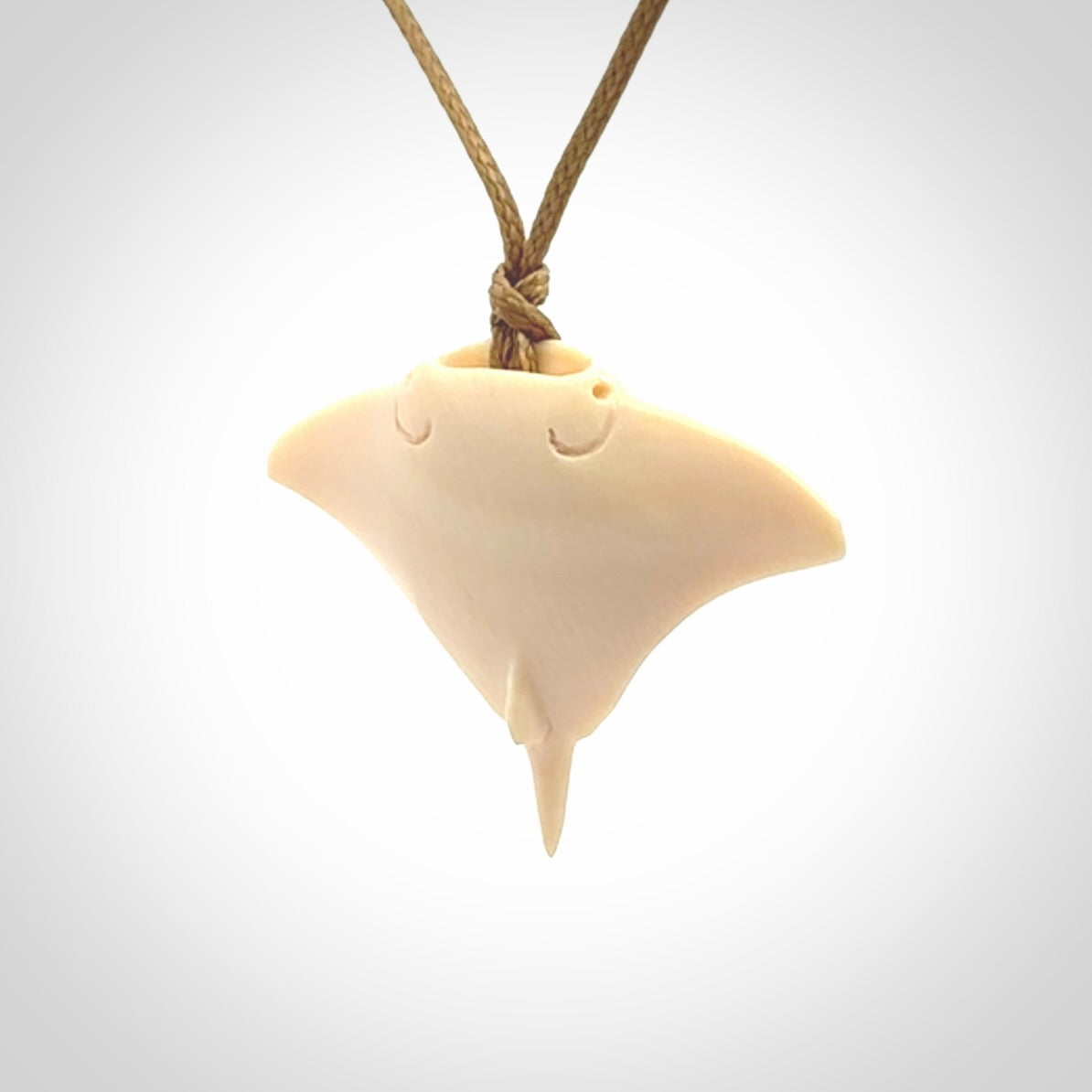 Woolly mammoth tusk manta ray pendant. Hand carved Mammoth Tusk manta ray pendant. Provided with adjustable cord.