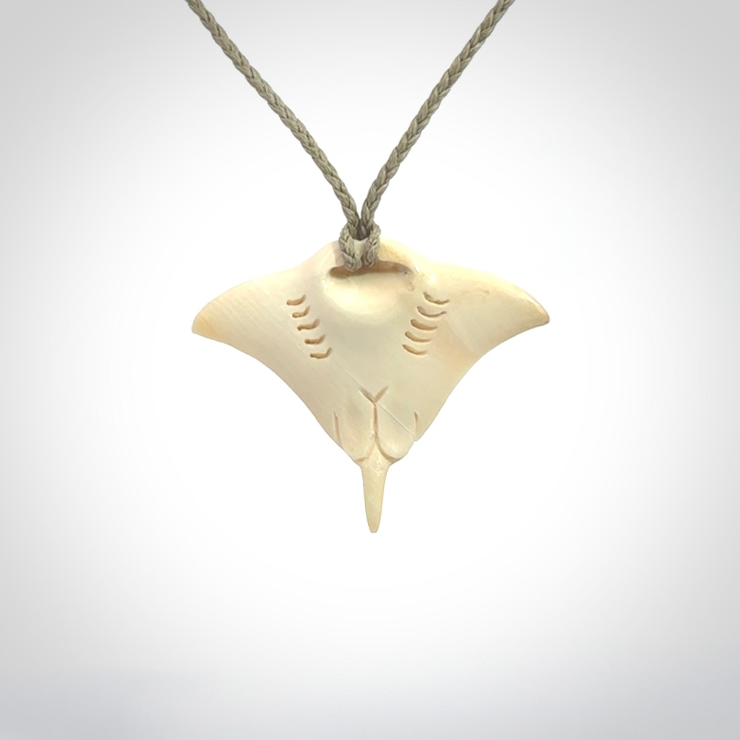 Woolly mammoth tusk manta ray pendant. Hand carved Mammoth Tusk manta ray pendant. Provided with adjustable cord.