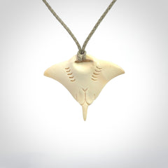 Woolly mammoth tusk manta ray pendant. Hand carved Mammoth Tusk manta ray pendant. Provided with adjustable cord.