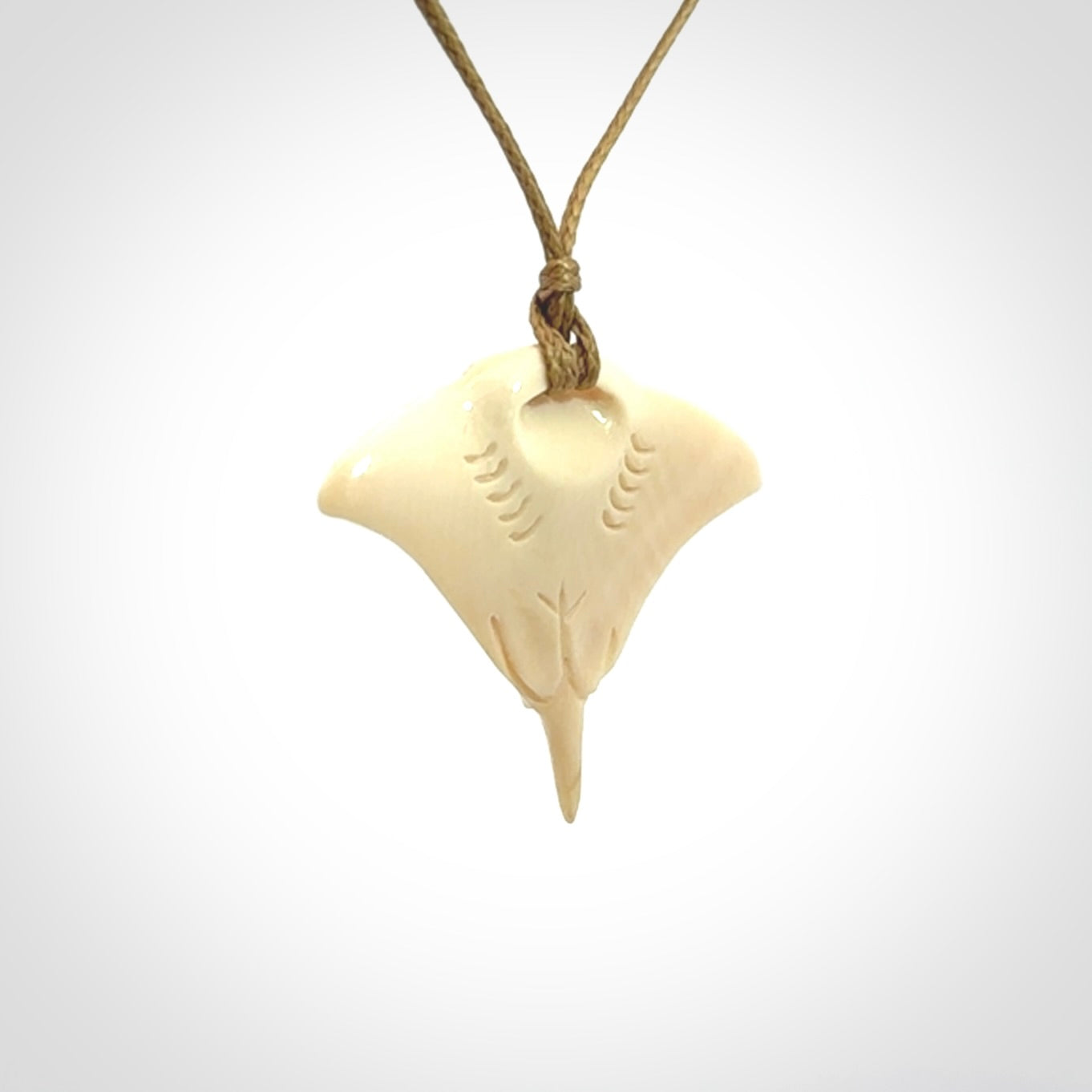 Woolly mammoth tusk manta ray pendant. Hand carved Mammoth Tusk manta ray pendant. Provided with adjustable cord.