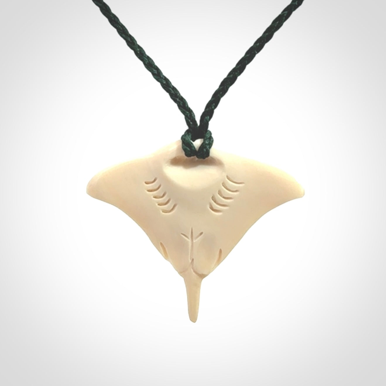 Woolly mammoth tusk manta ray pendant. Hand carved Mammoth Tusk manta ray pendant. Provided with adjustable cord.